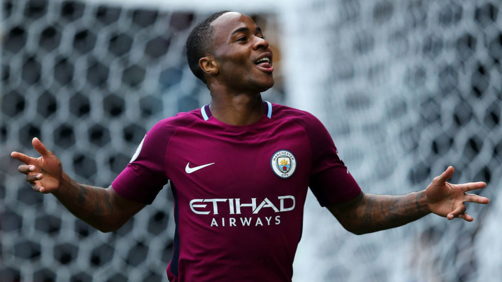 SPOT ON: Raheem Sterling celebrates after netting from the penalty spot