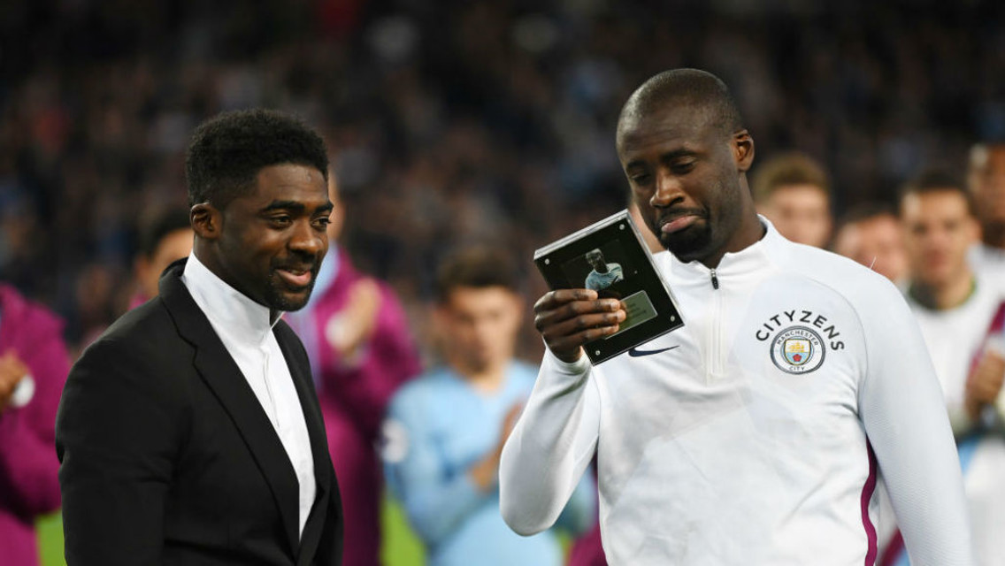 FAMILY AFFAIR: Kolo Toure presents a leaving gift to brother Yaya