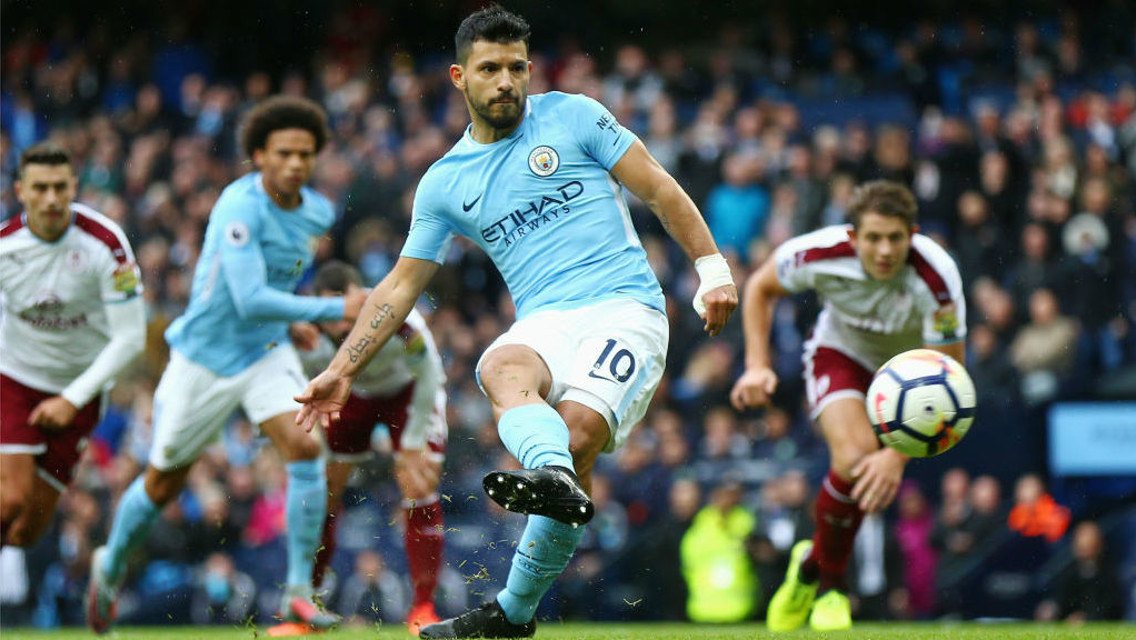SPOT ON: Sergio Aguero slams home his record-equalling penalty