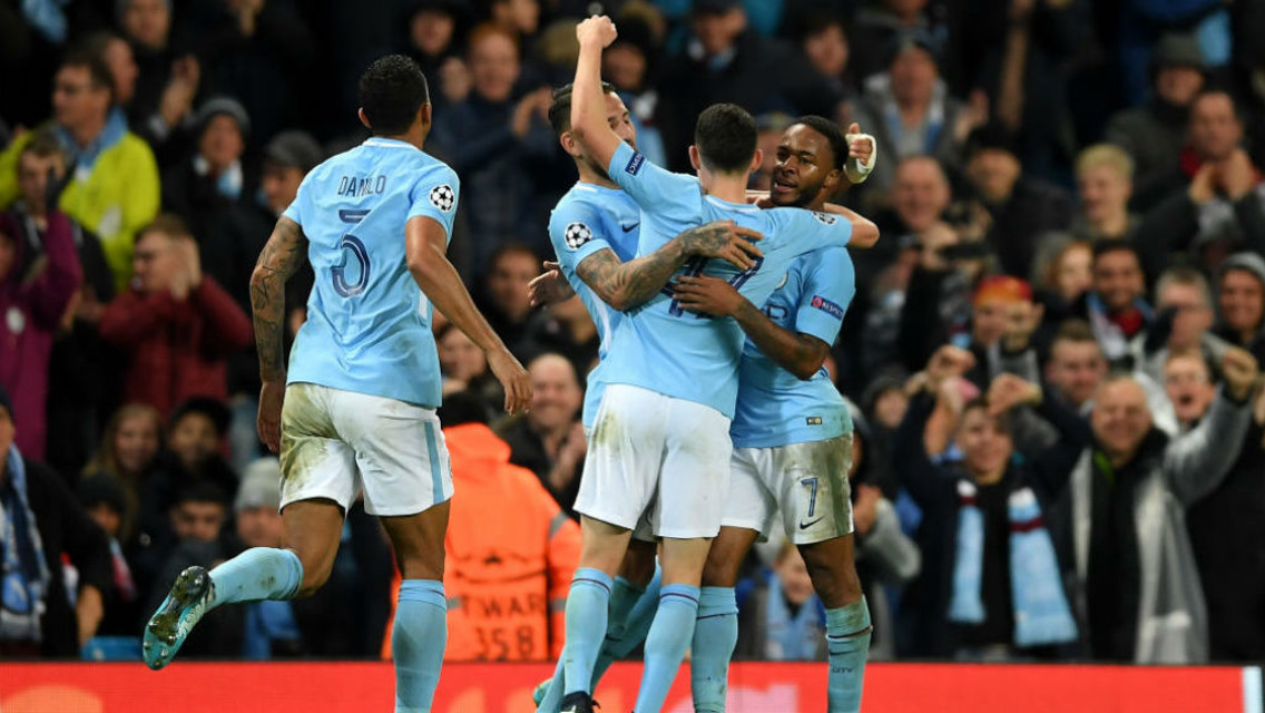 TOP SPOT: City players celebrate Sterling's winner 