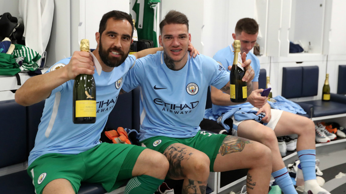 GOALKEEPERS' UNION: Claudio Bravo and Ederson pop the champagne