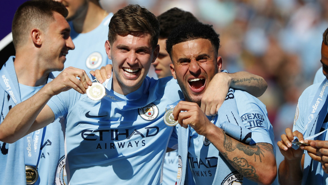 PREMIER LEAGUE DREAMS: John Stones and Kyle Walker celebrate their first league titles