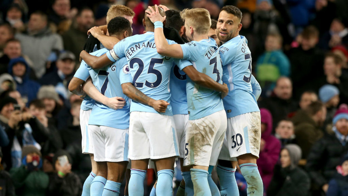 THREE: The team celebrate together after Sergio Aguero's second goal of the afternoon.