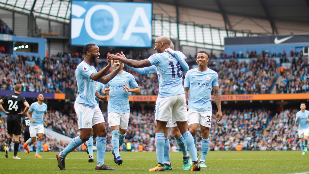 TEAMWORK: Provider Fabian Delph celebrates with goalscorer Raheem Sterling.