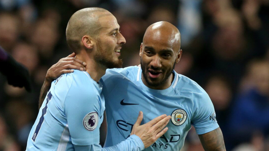 DELIGHT: Fabian Delph congratulates David Silva on his strike