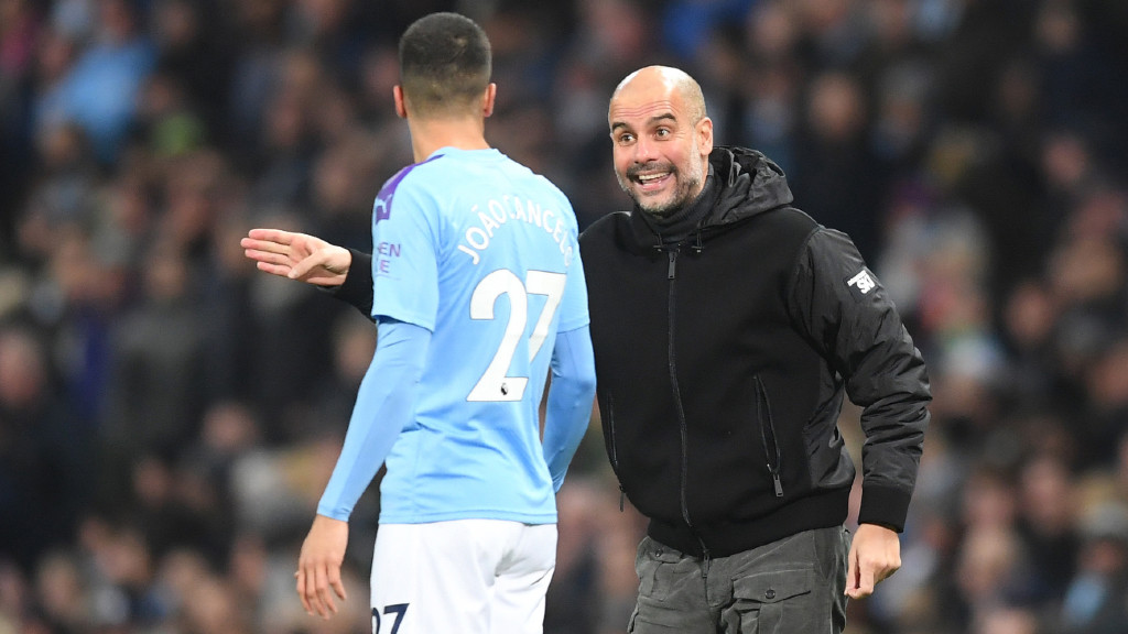 PEP TALK: Pep Guardiola delivers instructions to Joao Cancelo