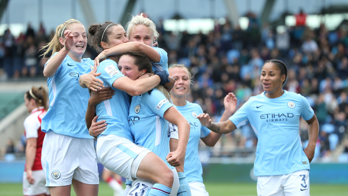 TOGETHER: The team rush over to congratulate Jane Ross on the opener