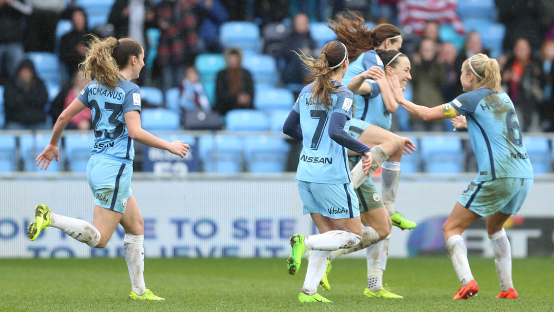 GET IN: The team celebrates Lucy Bronze's late winner!