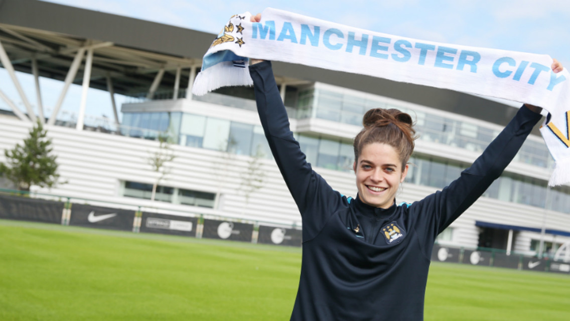 NEW BLUE: Tessel Middag holds a City scarf aloft