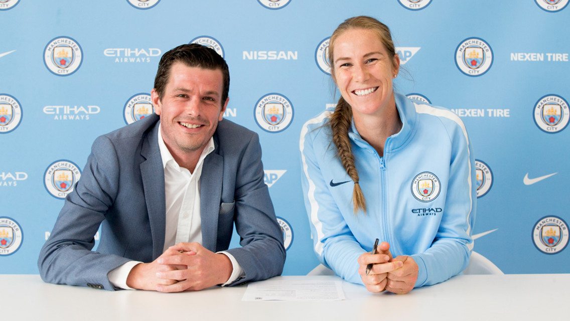 SHE'S A KEEPER: Karen Barsdley puts pen to paper on a new contract, alongside Head of Women's Football Gavin Makel