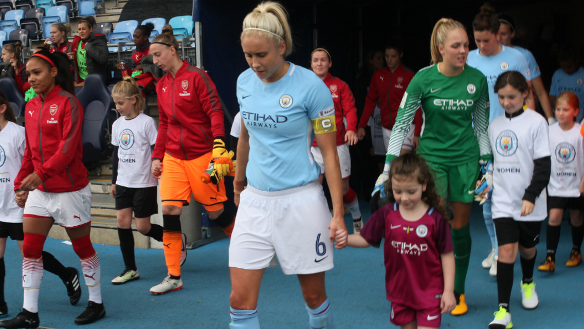 SPECIAL MOMENT: Steph Houghton leads the team out with a mascot
