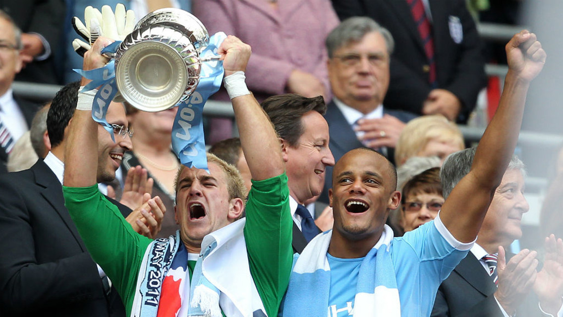 TROPHIES: Hart lifts the FA Cup after the 2011 success