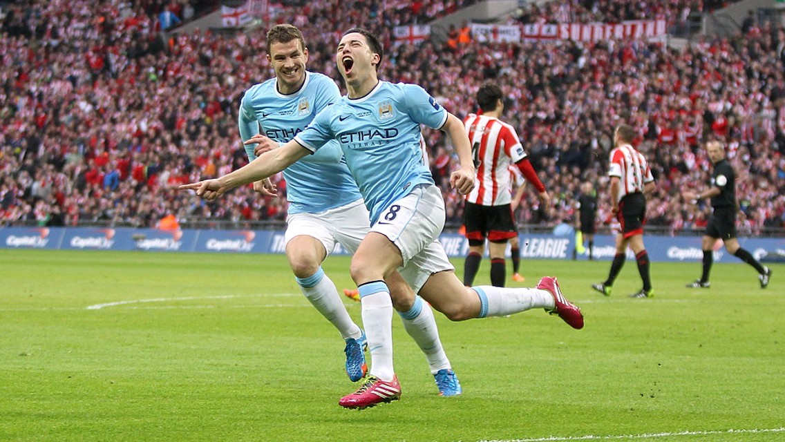 WHEELING AWAY: Nasri celebrates his spectacular goal in the 2014 Capital One Cup final.