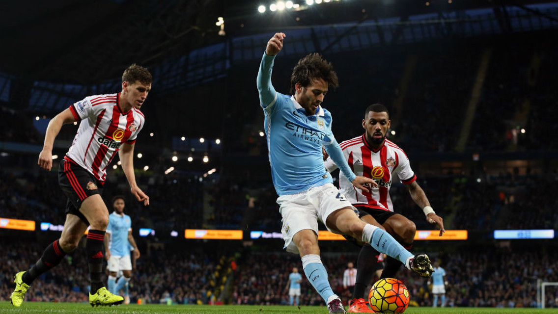 WHICH WAY?: Silva tries to evade Sunderland defenders during a tie between the sides last season