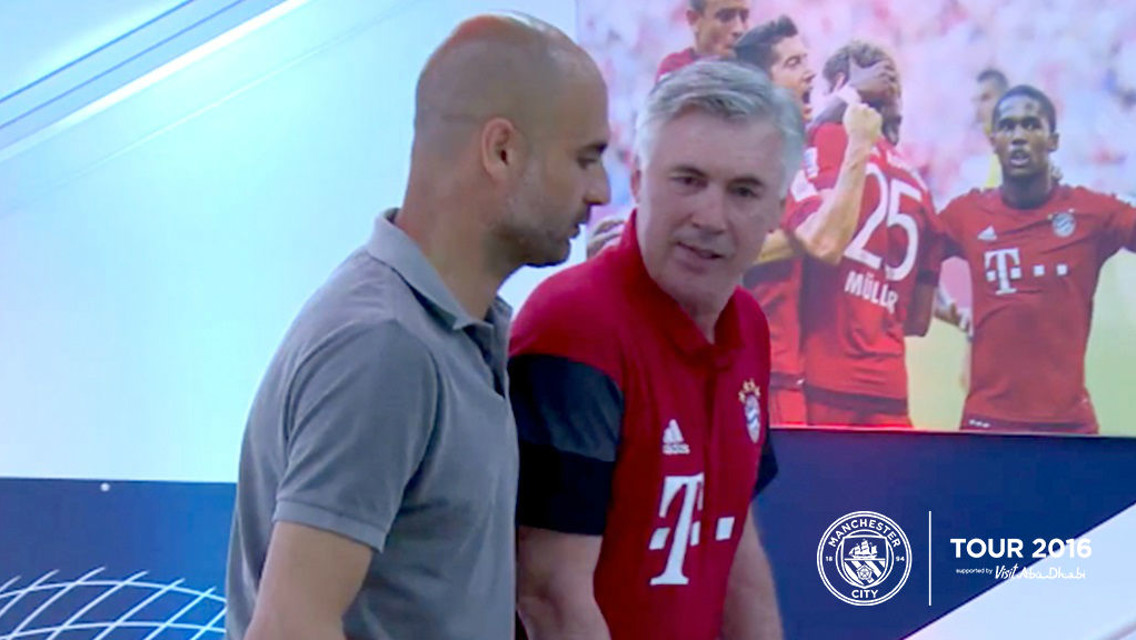 FRIENDS REUNITED: Pep and Carlo Ancelotti catch up at the Allianz 