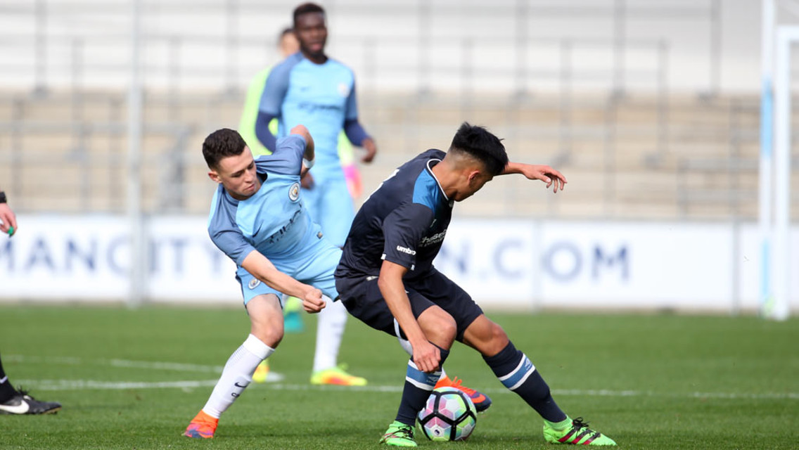 MIDFIELD BATTLE: Foden tries to win the ball in the centre of the park