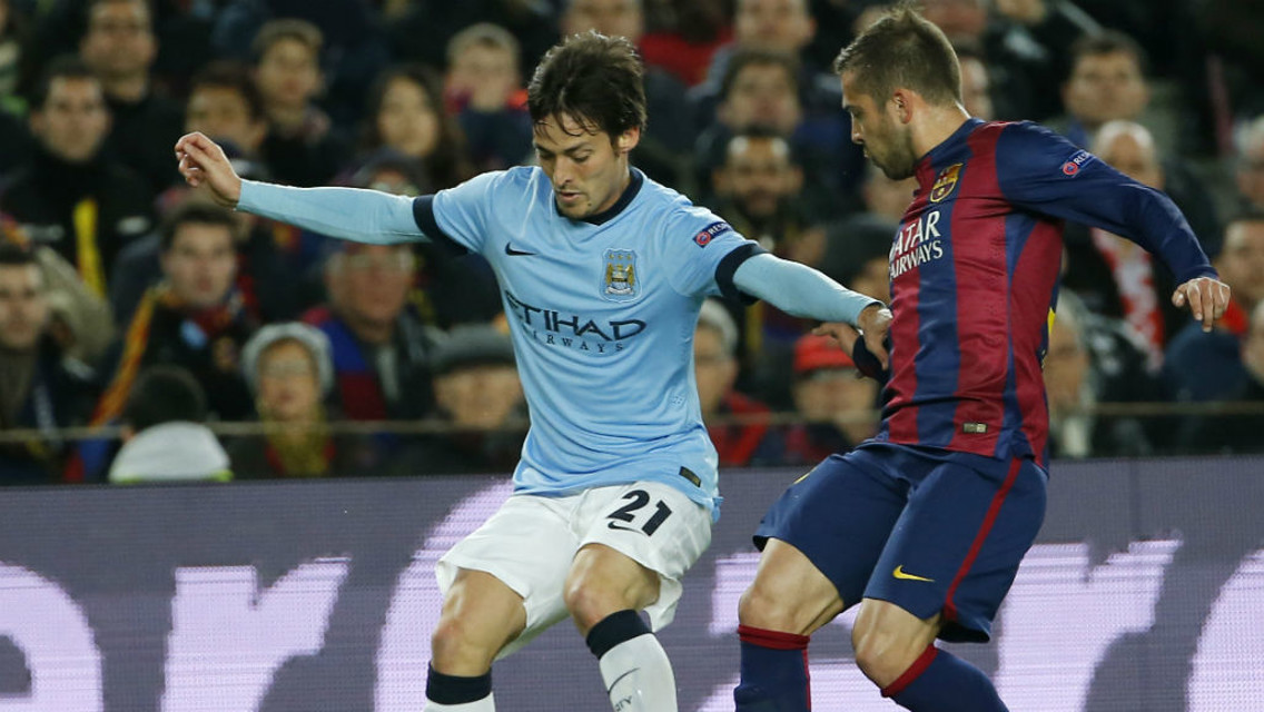 CLOSE MATCH: David Silva and Jordi Alba compete during the last meeting between the two sides