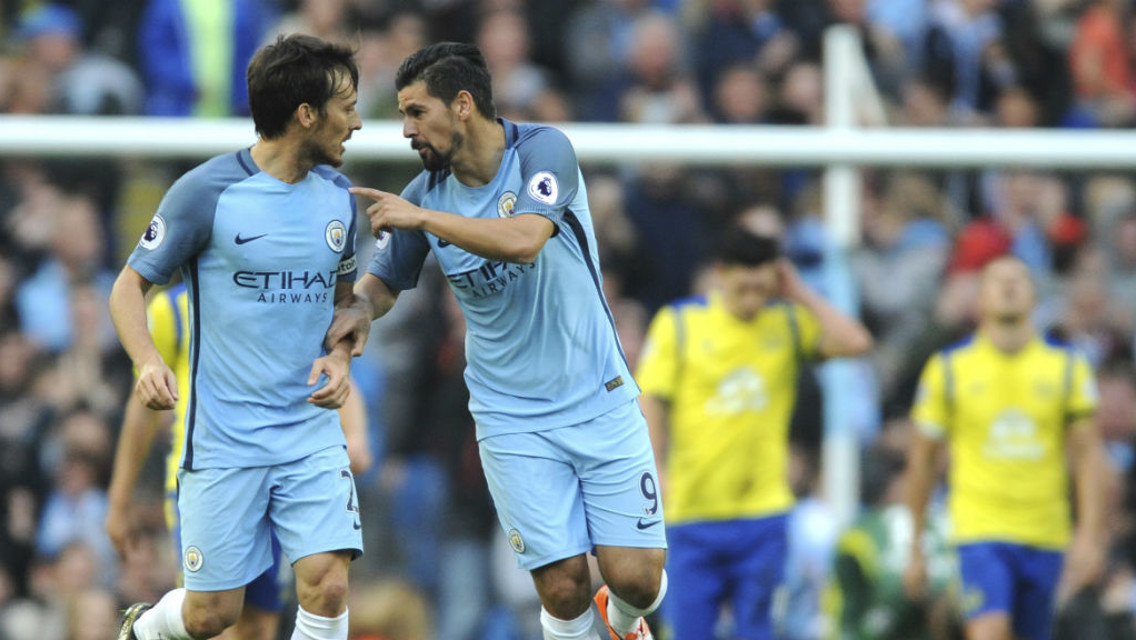 BACK IN TO IT: Silva and Nolito react to the latter's goal during Silva's excellent showing against Everton