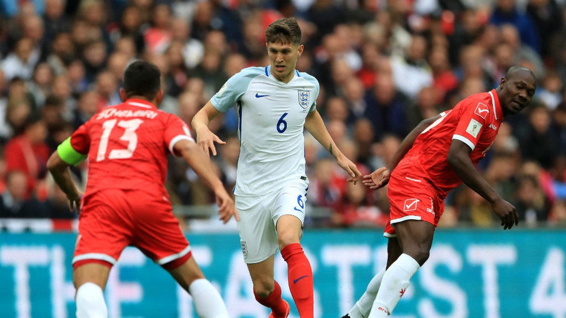 BALL CARRIER: Stones brings the ball out of defence in typically composed fashion