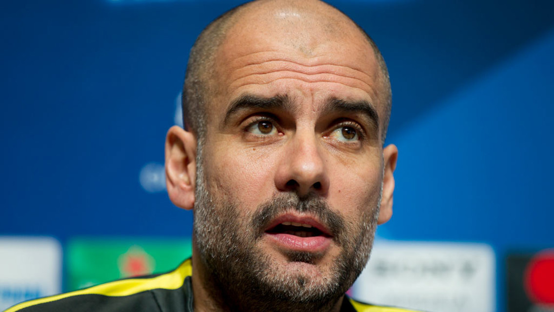 PEP: City's manager listens intently as he awaits questions before the Monaco clash