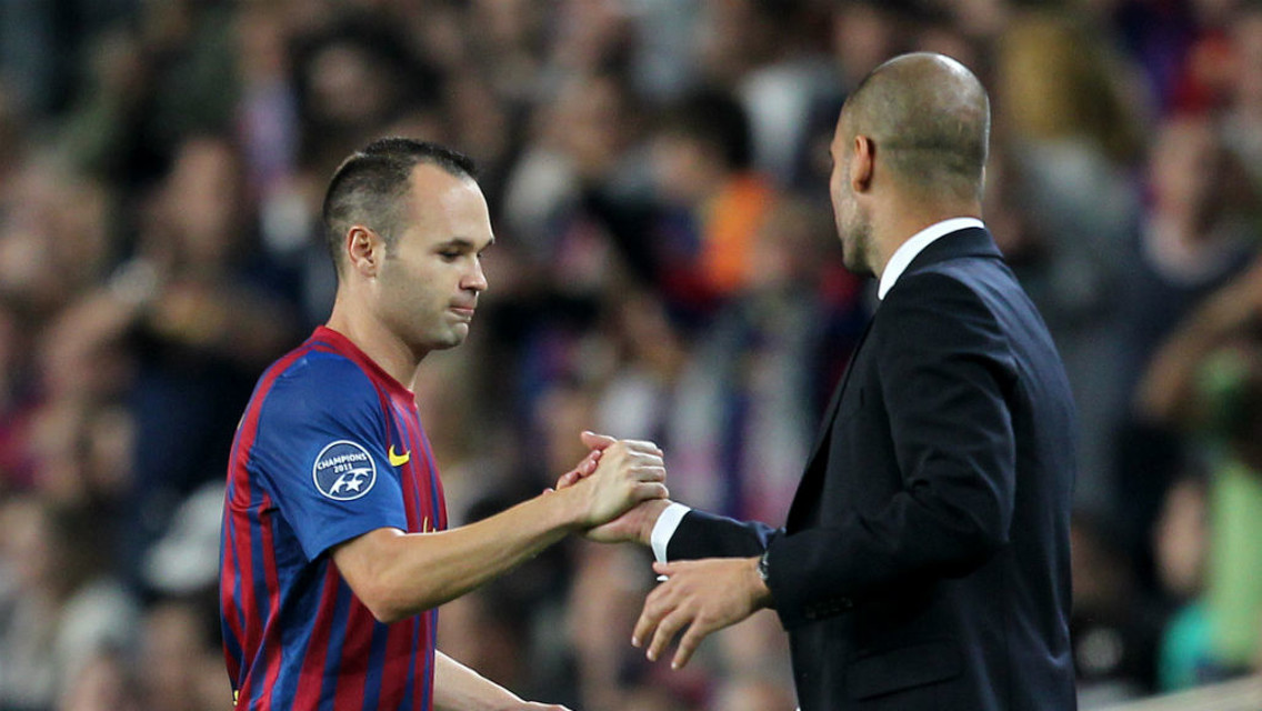 HANDSHAKE: Guardiola and Iniesta had a good working relationship at Barcelona