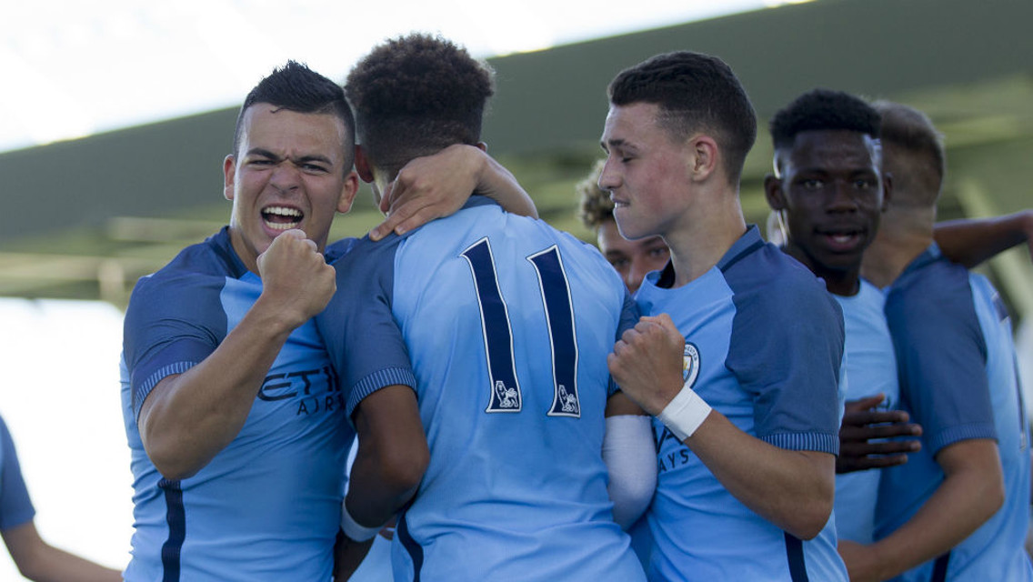 GET TOGETHER: Lee Carsley's team come together after the first half goal
