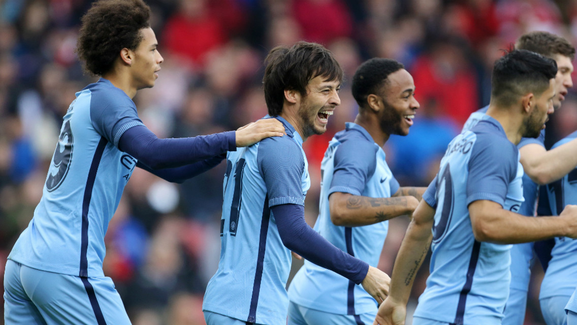 MAGIC: The City players rush over to congratulate David Silva