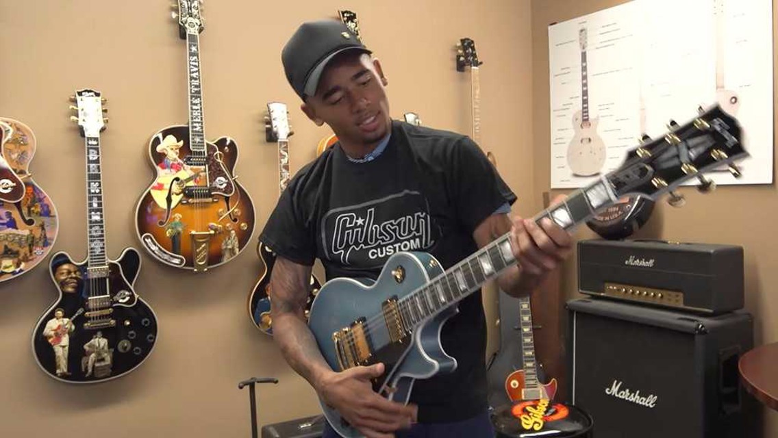 WINNING TUNE: Gabriel Jesus tries out one of the famous Gibson guitars