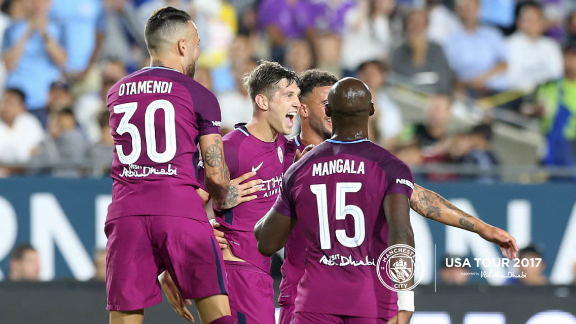 FEELING GOOD: John Stones (centre) after scoring against Real Madrid