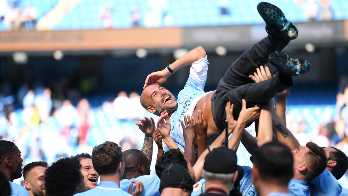BUMPS FOR THE BOSS: The squad celebrate with Pep Guardiola