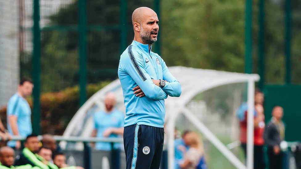 WATCHFUL EYE : Pep Guardiola surveys the scene