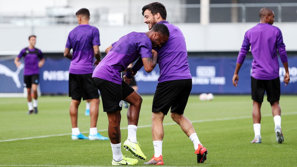 CAPTAIN MARVEL : David Silva wrestles with Raheem Sterling.