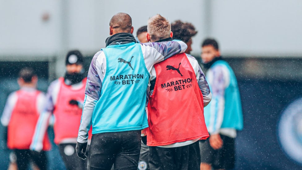 BROTHERS IN ARMS : Oleksandr Zinchenko gets an arm round the shoulder from Fernandinho.