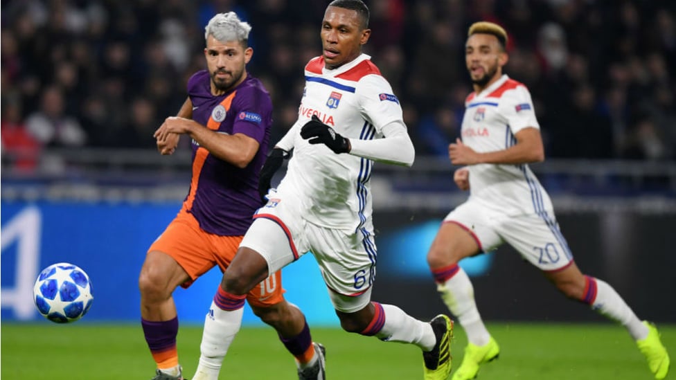 ACTION STATIONS : Sergio Aguero chases down Lyon's Marcelo