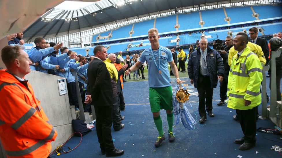 TROPHY : Hart brings the Premier League trophy into the tunnel after being crowned 2013/14 Champions!