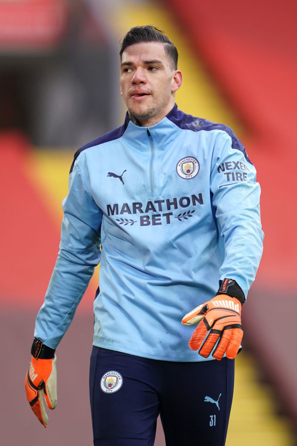 STEADY EDDIE : The Brazilian gets in the mood during the pre-match warm up.