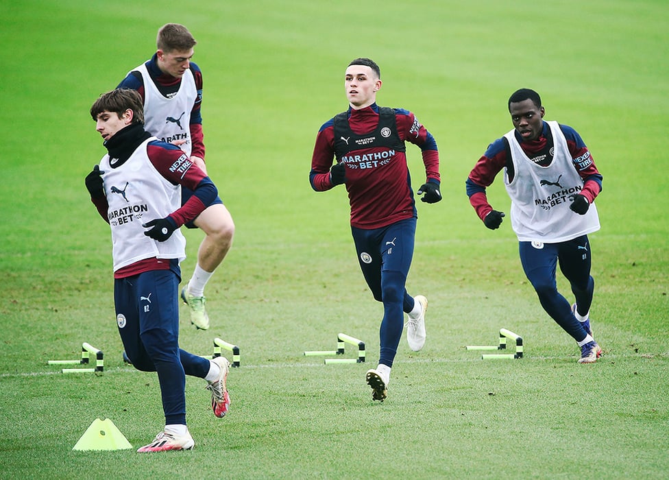 ON THE MOVE : Phil Foden works his way through a warm up.