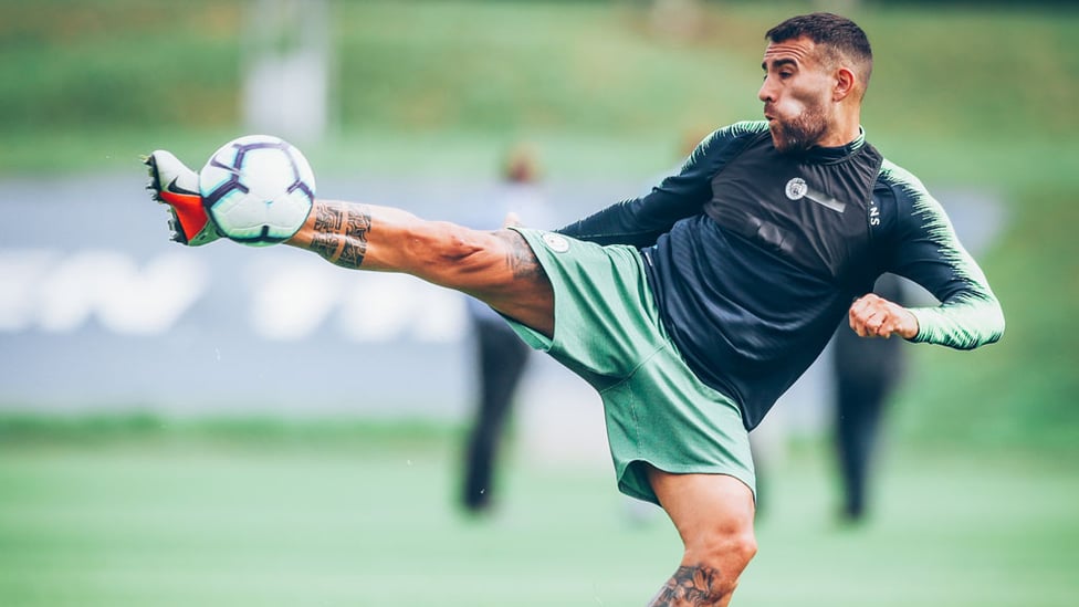 STRETCH : Otamendi tunes up for Sunday's game.