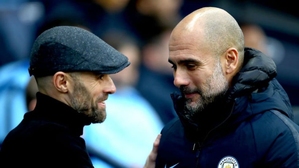 SHAKE ON IT : Pep Guardiola greets Rotherham counterpart Paul Warne