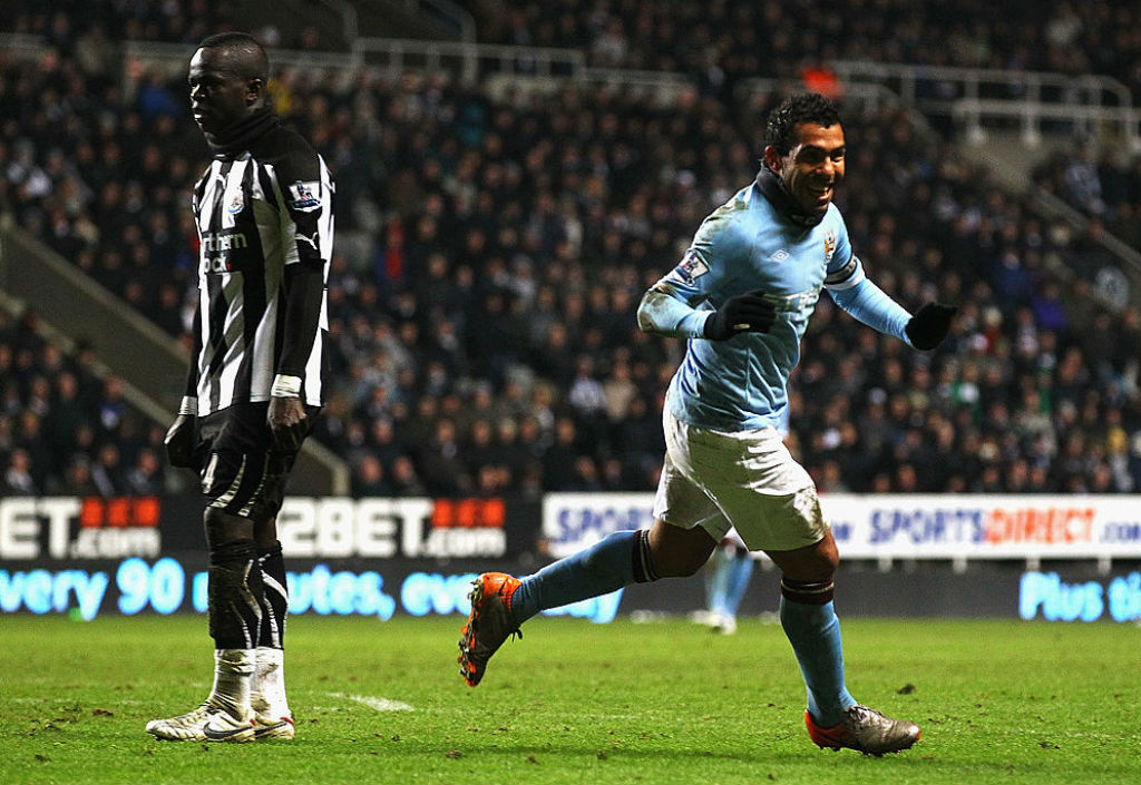 THREE CHEERS: Carlos Tevez starts the celebrations after sealing victory