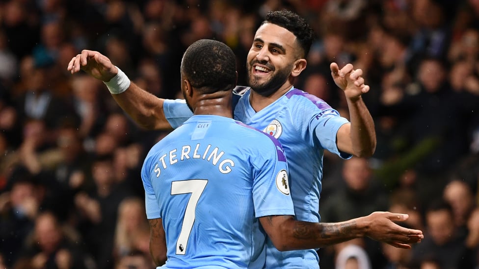 TOP TWO : Raheem Sterling is the first to celebrate with Riyad Mahrez