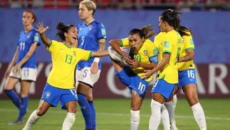 FILL YOUR BOOTS! Marta of Brazil celebrates with teammates after making World Cup history against Italy 