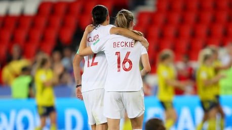 SISTERS IN ARMS: Christine Sinclair comsoles Janine Beckie