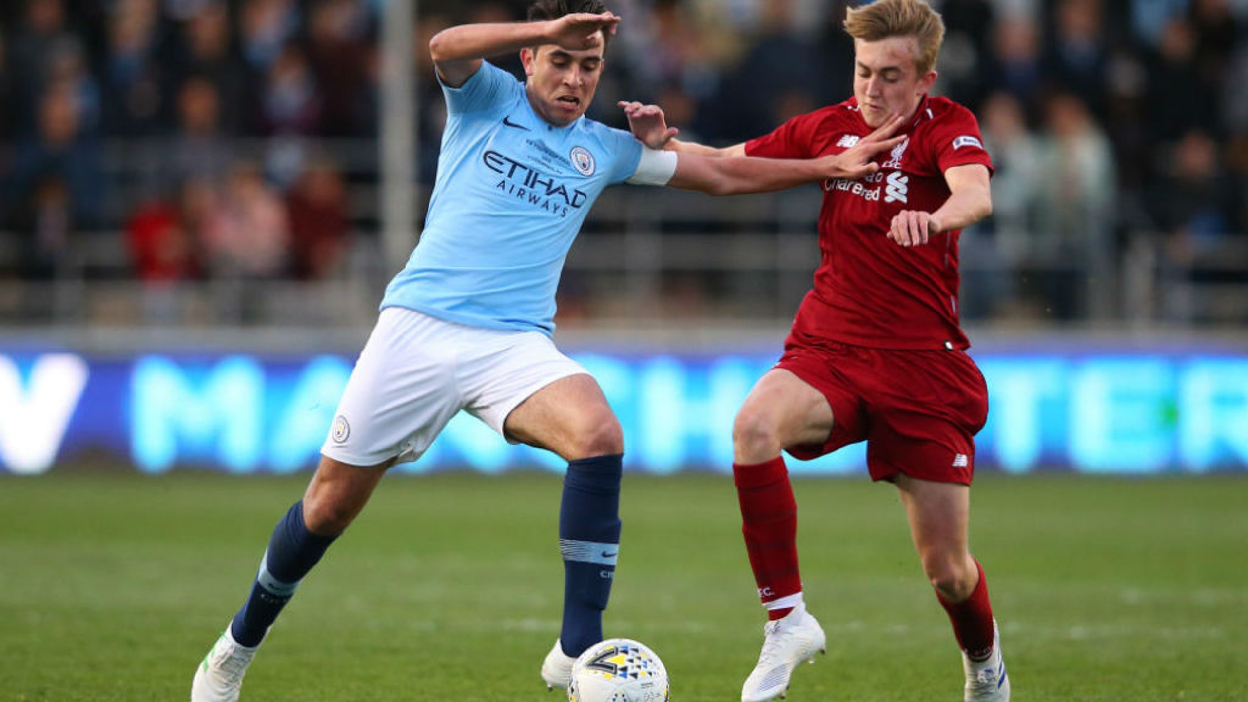ACTION STATIONS: City skipper Eric Garcia fends off Jake Cain of Liverpool