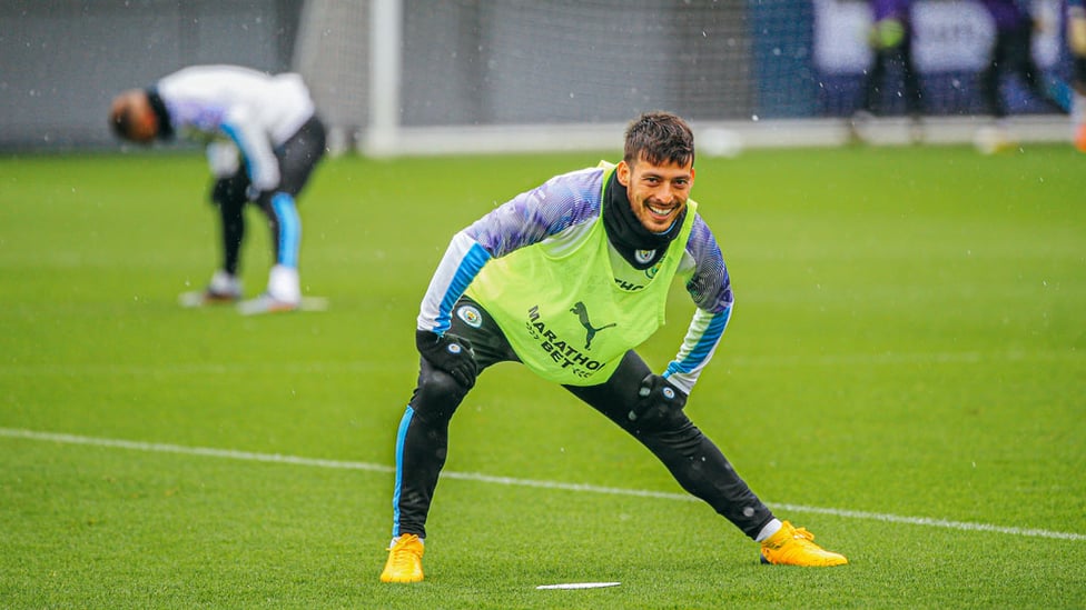 SILVA STRETCH: David Silva spots the camera as he warms up