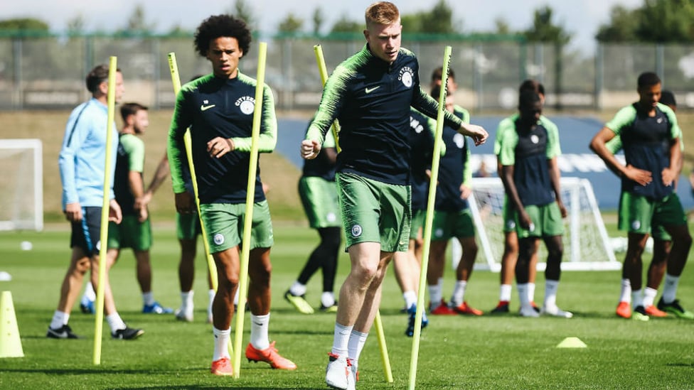 POLES APART : Kevin De Bruyne and Leroy Sane strike a pose