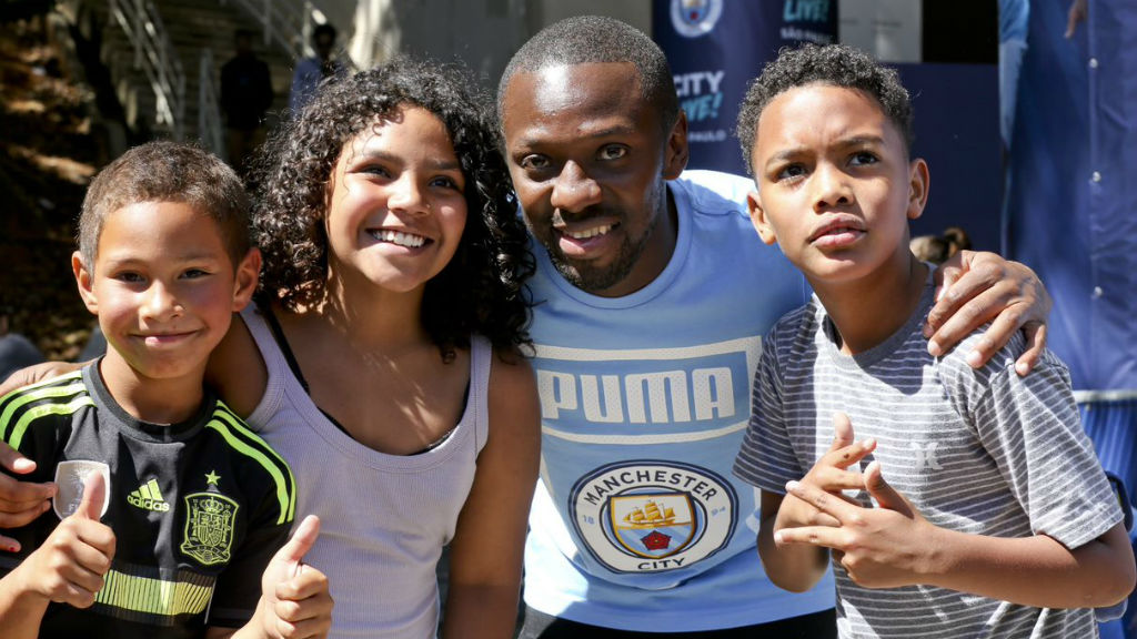 ALL SMILES : Shaun Wright-Phillips with some happy youngsters during our recent Trophy Tour to Brazil