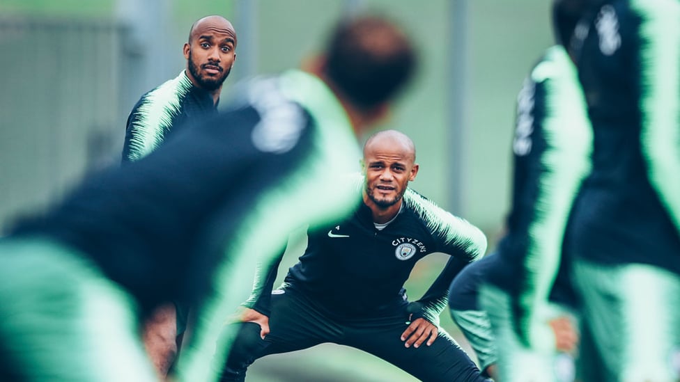 WIDE EYED : What's caught Delph and Kompany's eye?