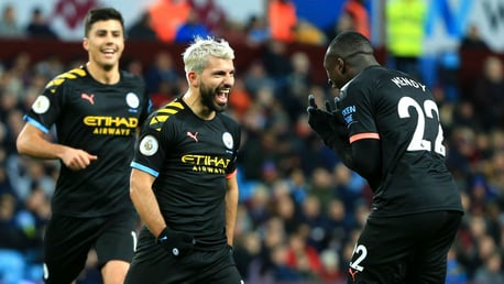 KUNDERFUL!! Sergio celebrates with Benjamin Mendy after his stunning first half strike