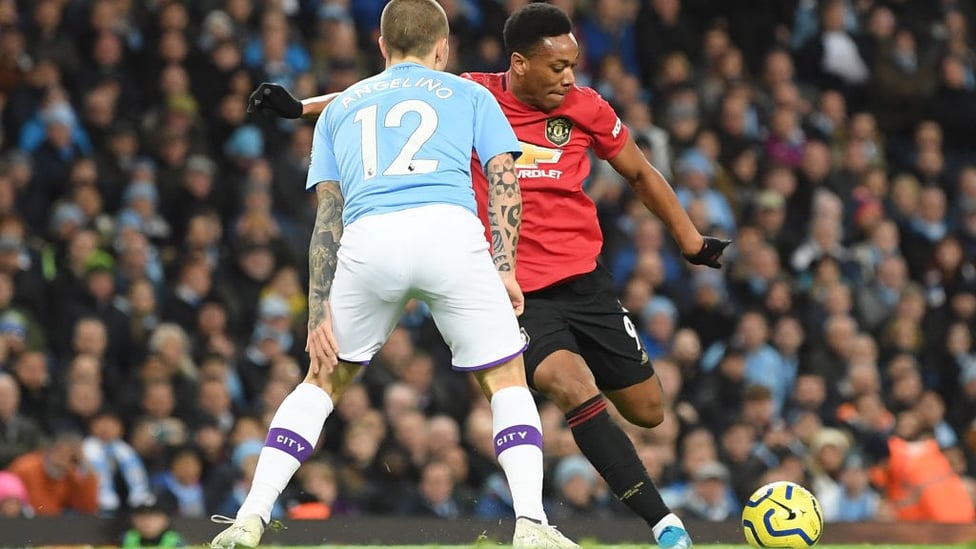 TRAILING : Anthony Martial takes aim for United's second goal.